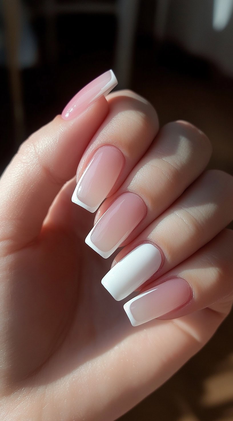 Square nails with a pink-to-white ombré base and sharply defined white French tips.