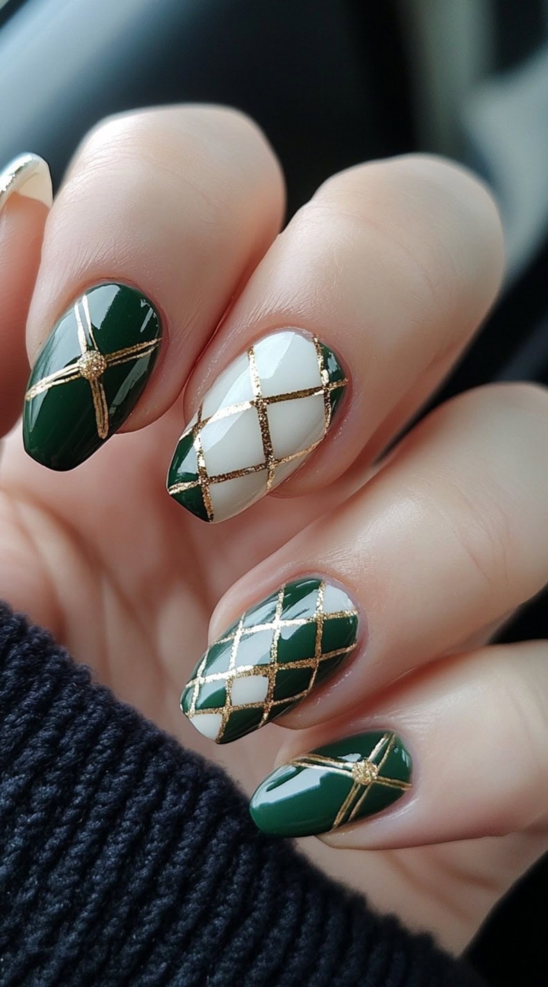 A set of deep green and white nails with an elegant gold lattice pattern, creating a sophisticated, geometric aesthetic.