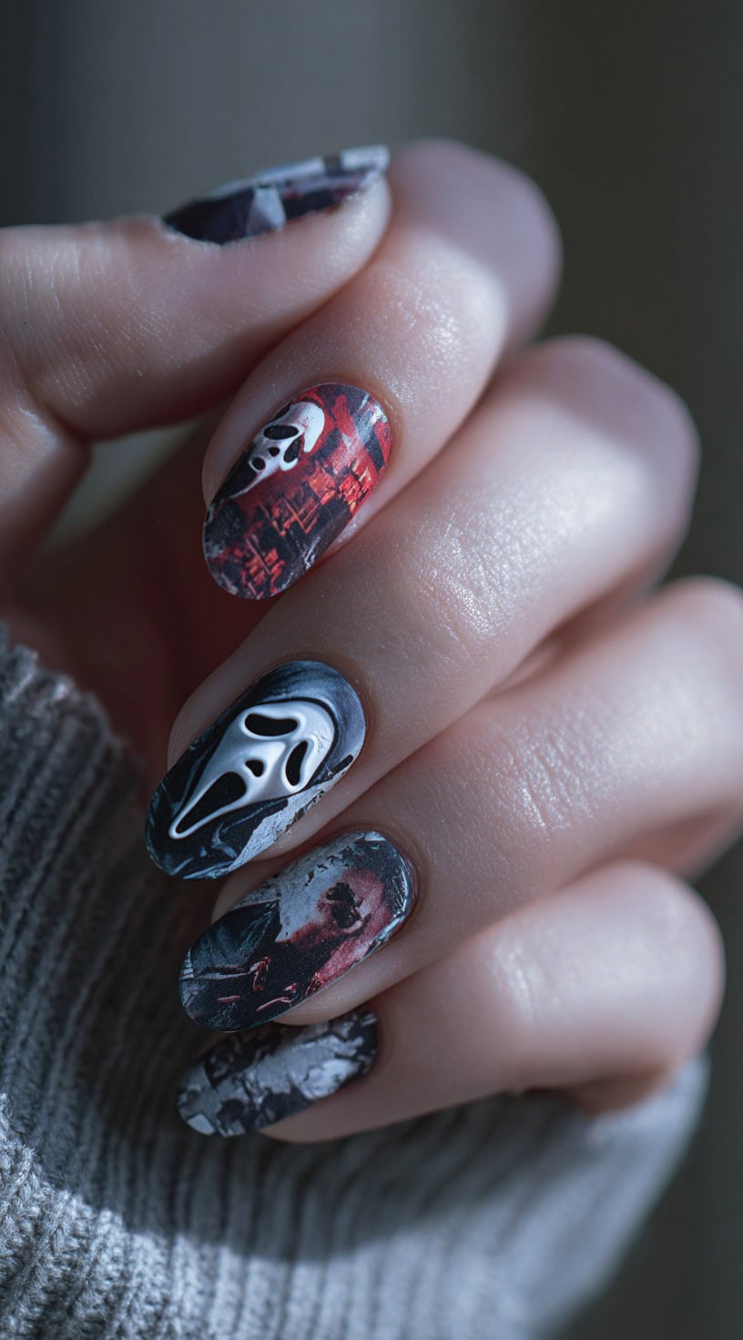 Oval nails featuring a collage of red cityscapes, black-and-white ghostface images, and dark horror-inspired prints.