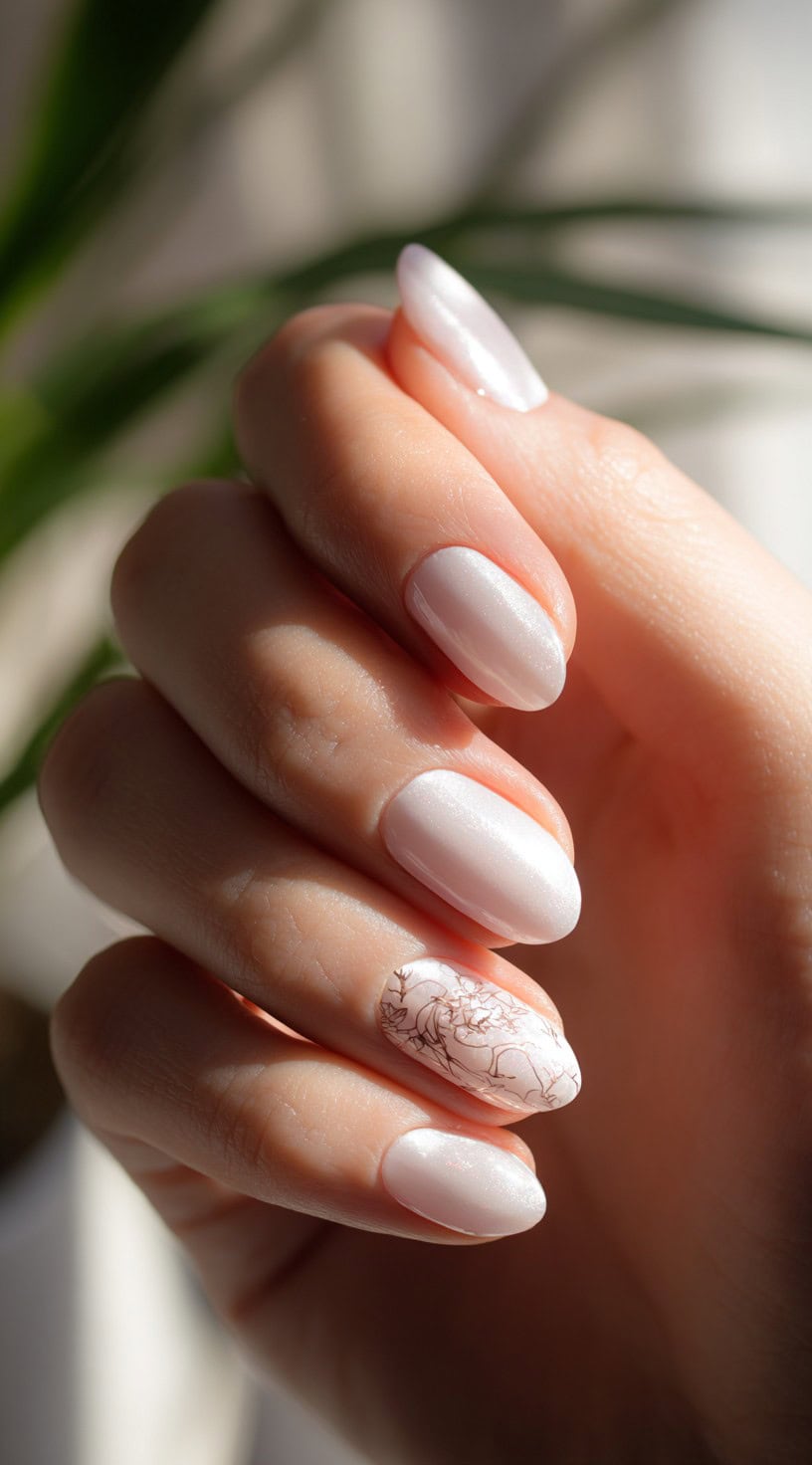 Milky white, semi-sheer nails with a smooth shimmer finish and a single nail featuring delicate abstract line art.