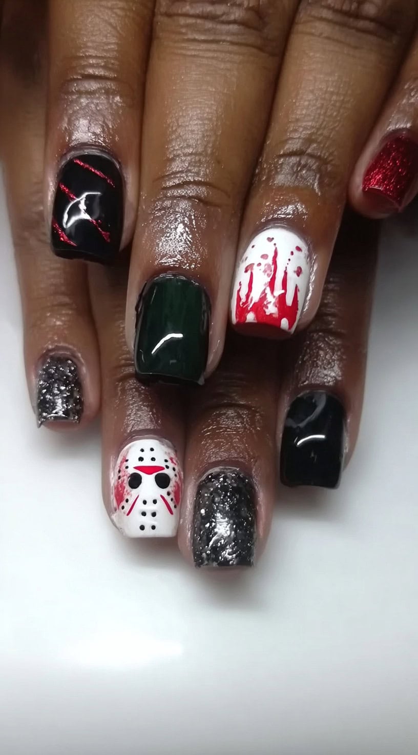 Square nails in various designs including Jason's mask, red blood drips, glitter, black polish, and dark green.