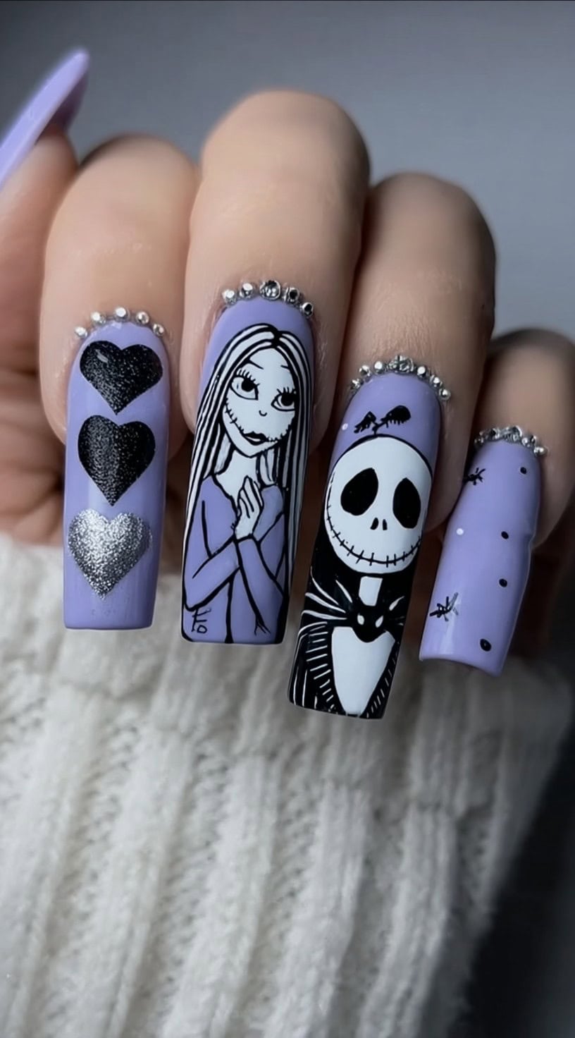 Long square nails painted pastel purple featuring Sally, Jack Skellington, hearts, and tiny silver beads at the cuticle line.