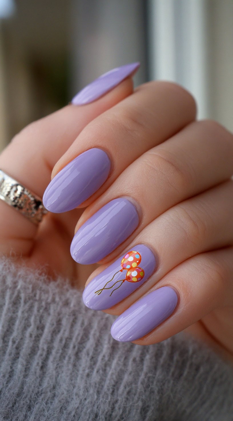Almond lavender nails with a single accent nail featuring two polka-dotted orange balloons.
