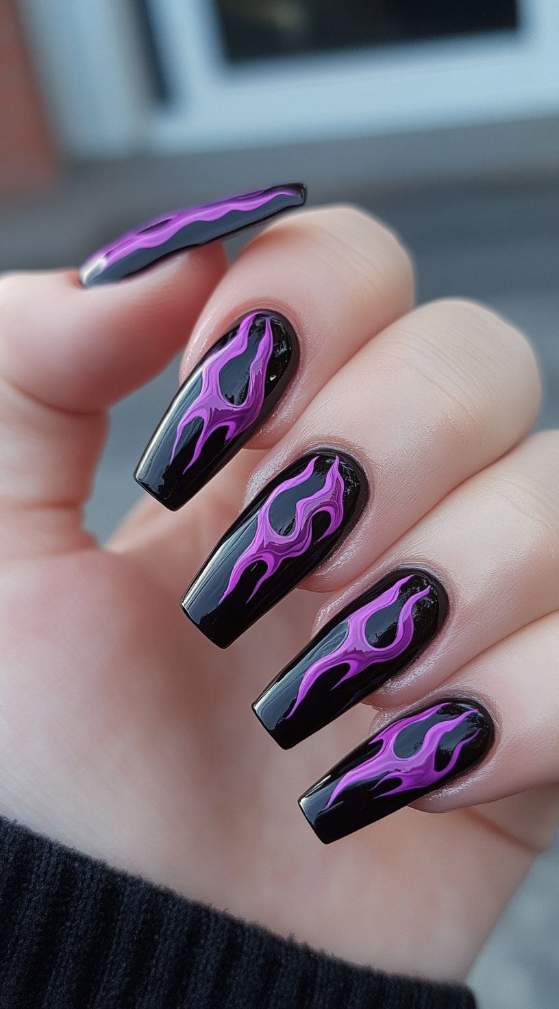 Glossy coffin-shaped nails featuring vibrant purple flame art over a black base.