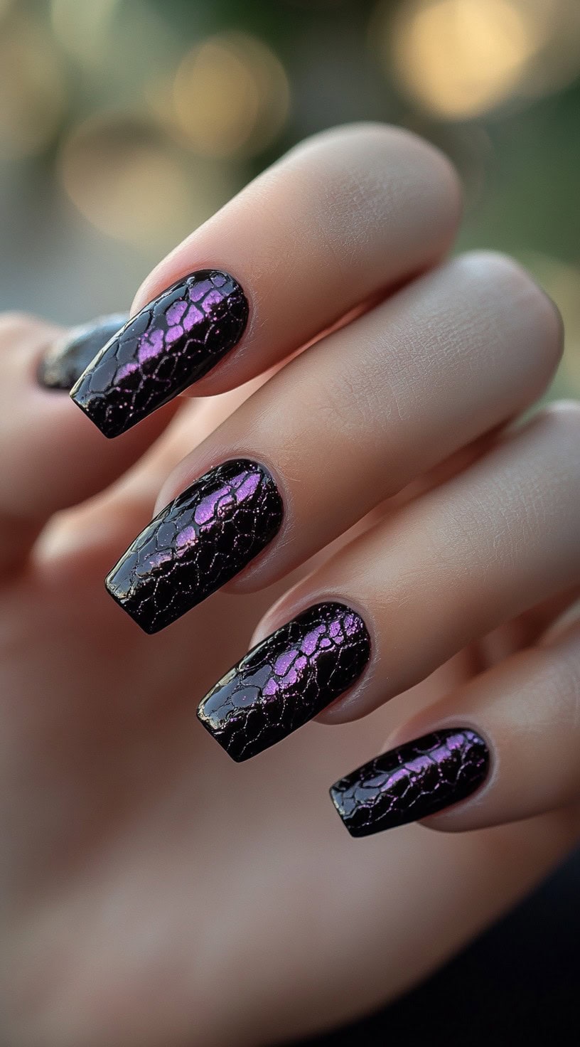 Glossy black square nails with shimmery purple snake print pattern overlay.