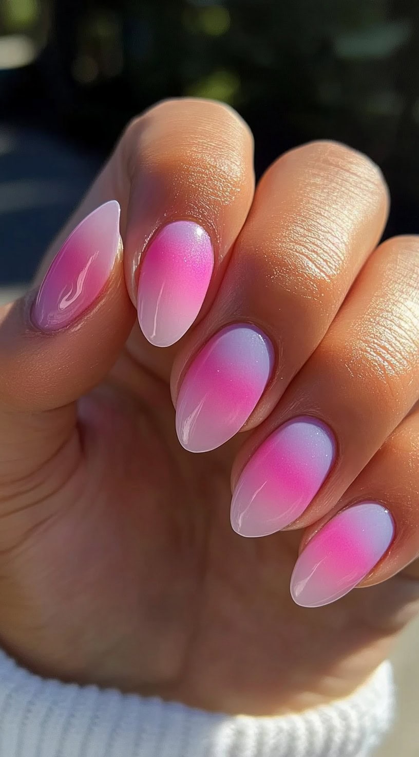 Almond-shaped nails with a gentle pink-to-white aura gradient, creating a soft and dreamy effect.
