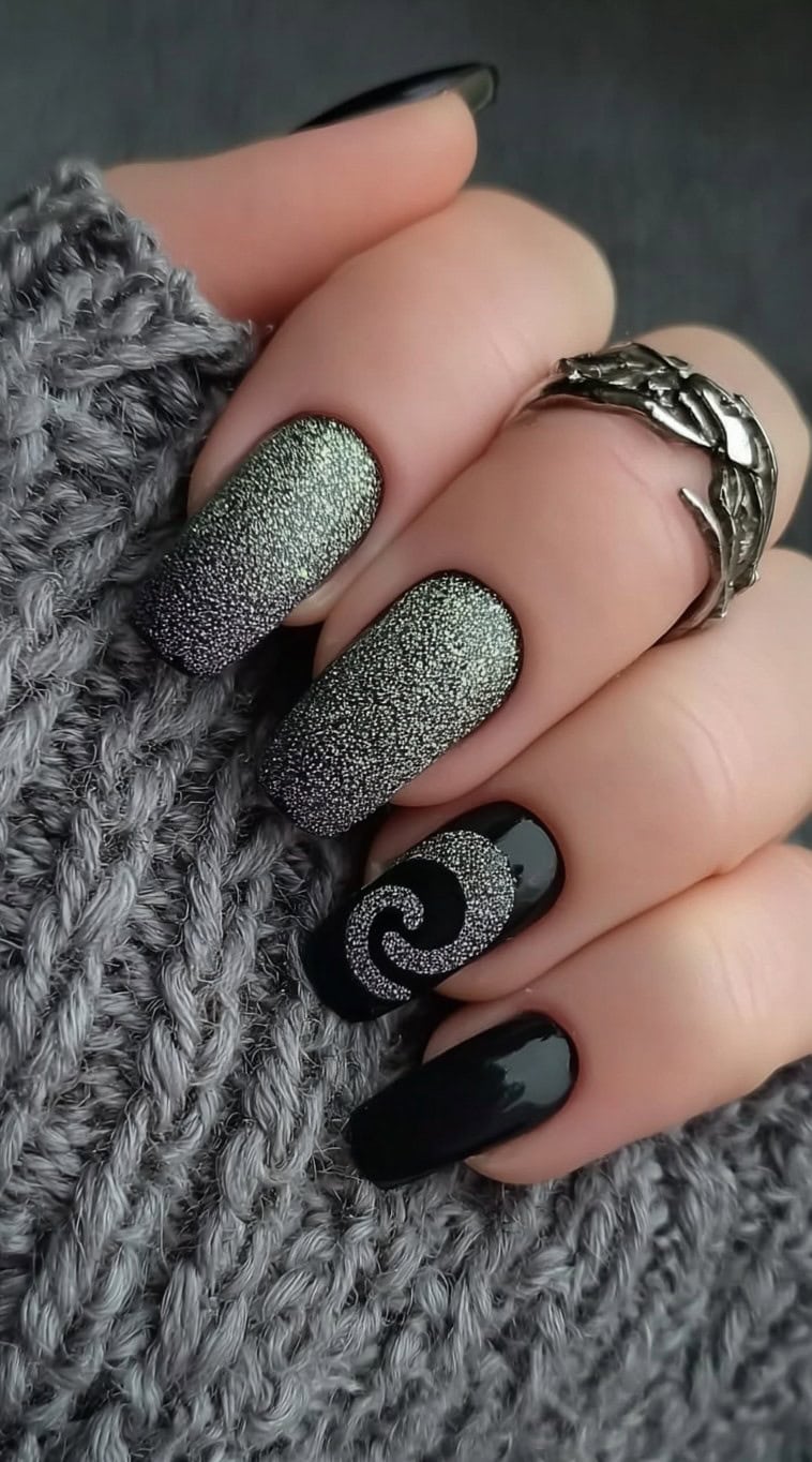 Square-shaped nails with a textured green-to-black gradient and a silver spiral design on a glossy black accent nail.